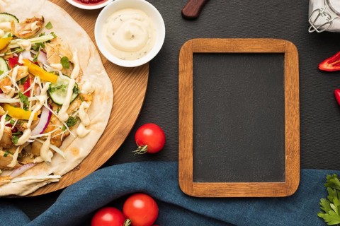 Top view delicious kebab with frame tomatoes