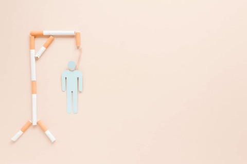 Top view hanging man made by cigarettes