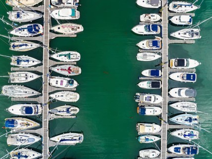 Top Down view over Boats and Yachts in Brixham Marina from a drone