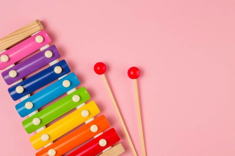 Flat lay colorful xylophone baby shower