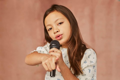 Little girl learning how sing home