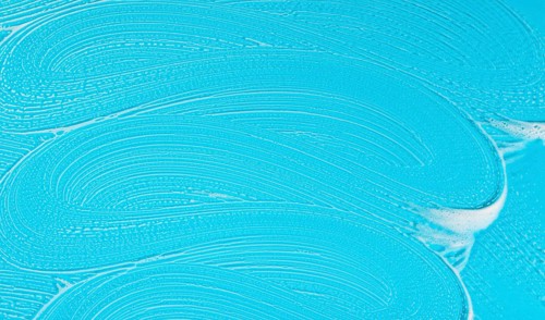 Flat lay soap foam blue background