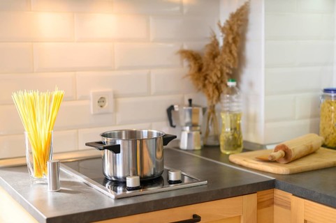 Modern apartment kitchen with pasta glass
