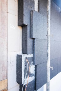 Insulation panels on a house facade of a new building