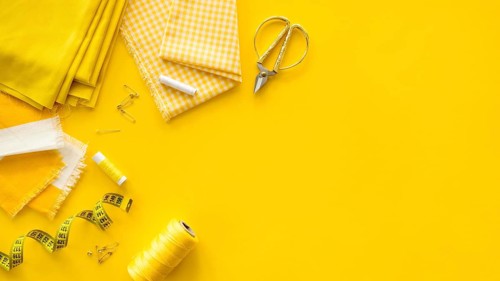 Flat lay sewing essentials with copy space