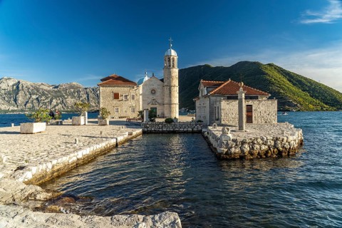 The artificial island of Gospa od Skrpjela with the church of St Mary on the rock near Perast on the Bay of Kotor