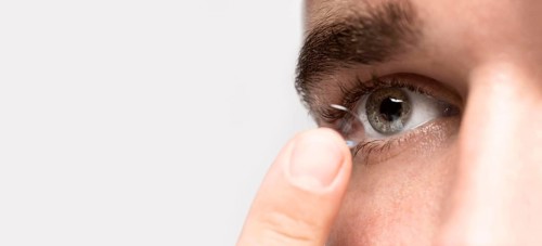 Man holding eye contact with copy space
