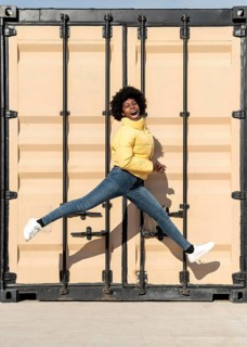 Portrait young woman jumping 1