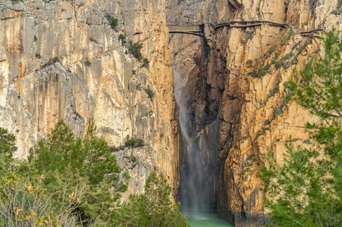 Suspension bridge and waterfall of the via ferrata Caminito del Rey near El Chorro
