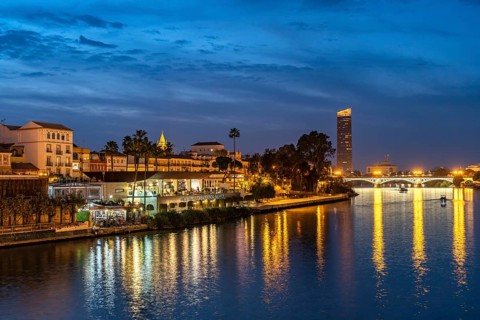 Triana neighbourhood on the banks of the Guadalquivir River at dusk