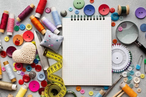 Top view haberdashery desk with accessories notepad