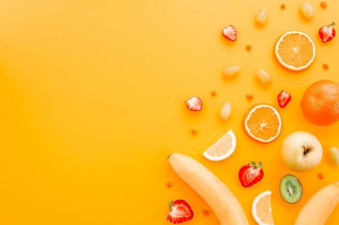 Assorted fruit yellow background