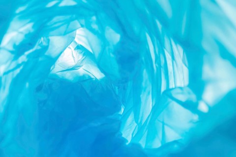 Flat lay arrangement blue plastic bags