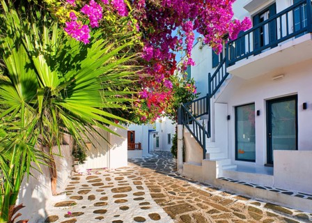 Romantic traditional narrow streets and beautiful walkways of Greek island towns. Whitewashed houses