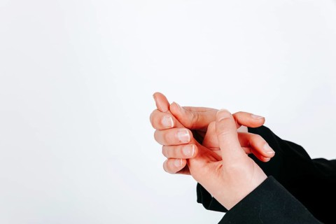 Crop female hands with pain finger