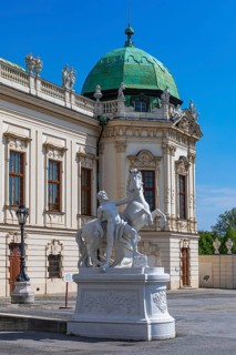 Stone horse and rider figure in front of the Belvedere Upper Baroque Palace