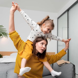 Medium shot mother girl indoors