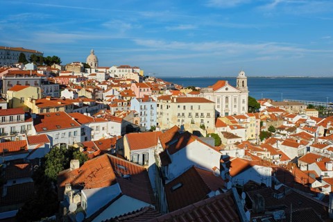 View of Lisbon famous postcard iconic view from Miradouro de Santa Luzia tourist viewpoint over Alfama old city district. Lisbon