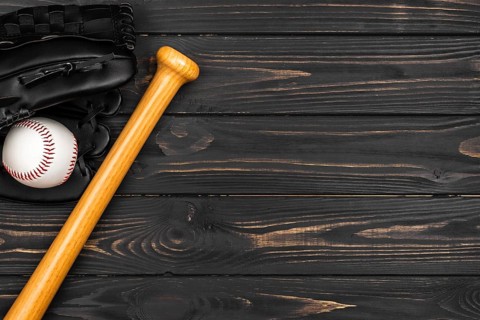 Flat lay baseball bat with glove ball