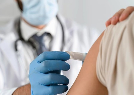 Man putting bandage young woman s arm
