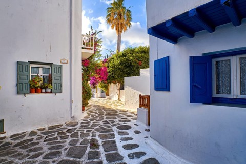 Romantic traditional narrow streets and beautiful walkways of Greek island towns. Whitewashed houses