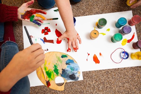 High angle child woman painting