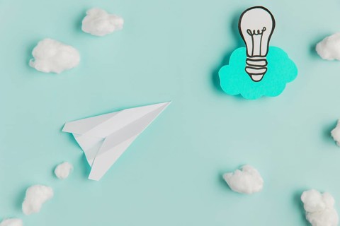 Copy space paper light bulb airplane