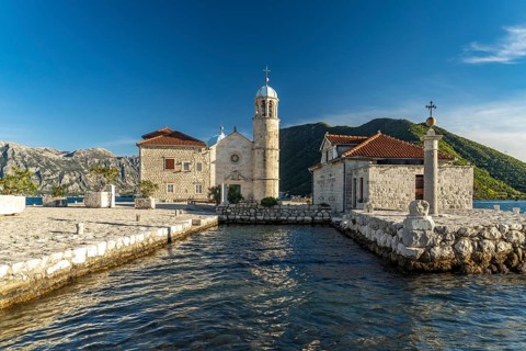 The artificial island of Gospa od Skrpjela with the church of St Mary on the rock near Perast on the Bay of Kotor