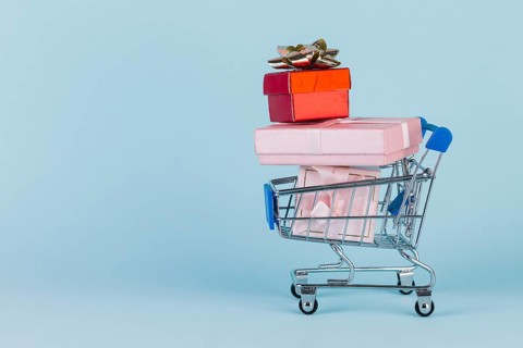 Gifts stacked shopping card blue surface