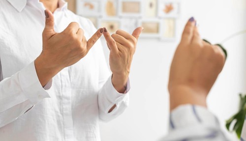 Group deaf people communicating through sign language
