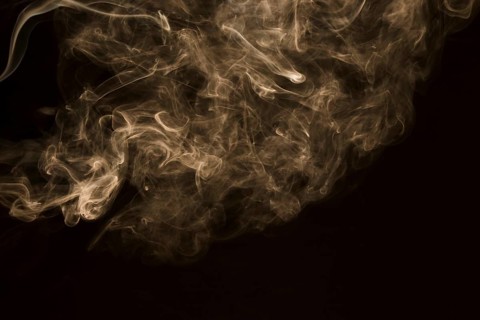 Swirling white fog black background