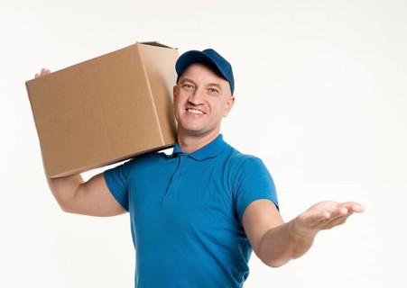 Front view delivery man carrying cardboard box