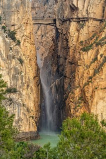Suspension bridge and waterfall of the via ferrata Caminito del Rey near El Chorro