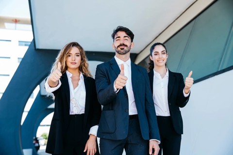 Team architects making thumbs up gesture