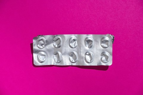 Empty tablet blister pack against a monochrome background