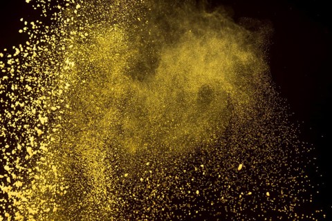 Bright dust makeup powder dark background