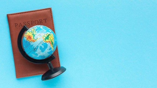 Flat lay passport world globe