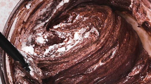 Close up mixed chocolate cake dough bowl