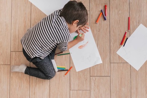 Little child painting like artist