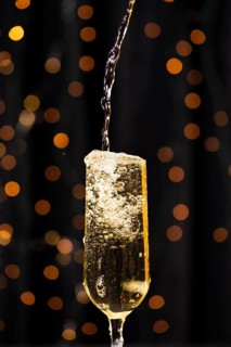 Front view pouring champagne glass