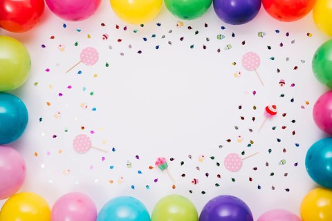 Colorful balloons border with confetti props white background