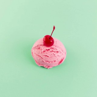 Pink ice cream ball with cherry