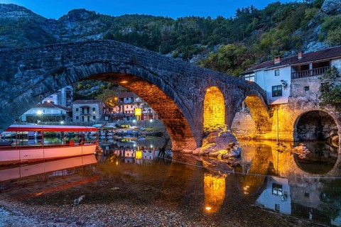 The Old Bridge Stari Most over the Crnojevic River in Rijeka Crnojevica at dusk