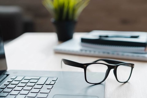 Office desktop with laptop analytics