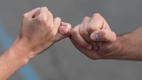 Pinky promise from man woman