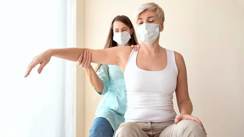 Female patient undergoing therapy physiotherapist