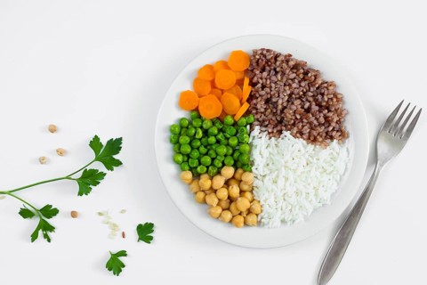 Different types porridge with vegetables plate