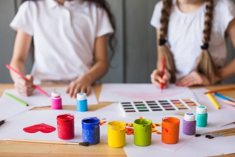 Colorful paint colors front girl painting white paper table