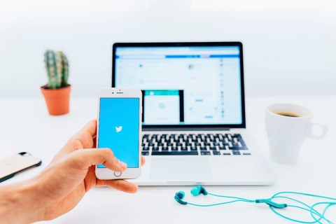 Phone with twitter laptop with facebook