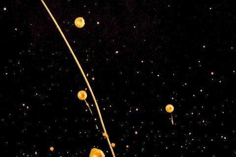 Elegant golden melted paint black background